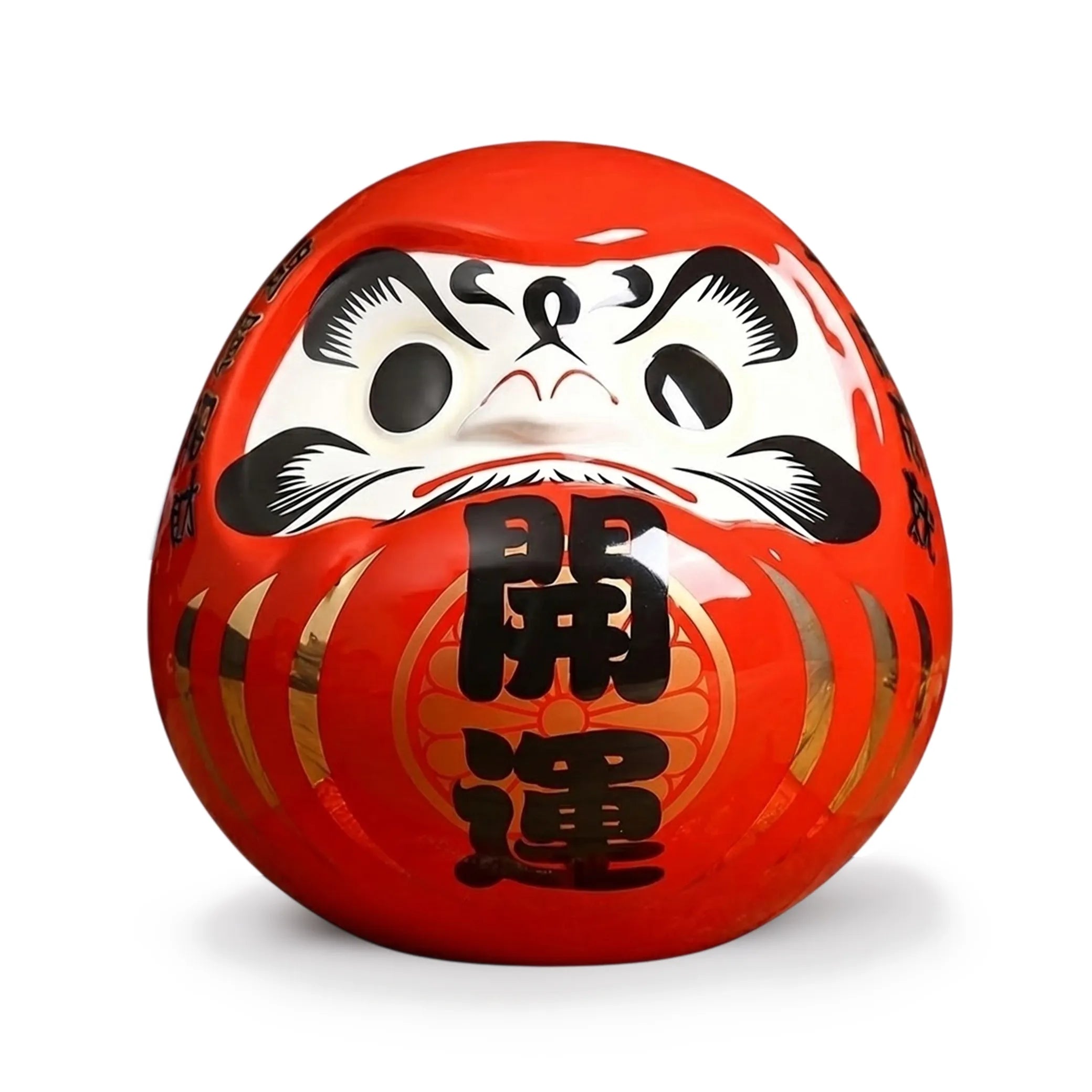 Tirelire Daruma rouge traditionnelle japonaise en céramique pour la chance et la persévérance.