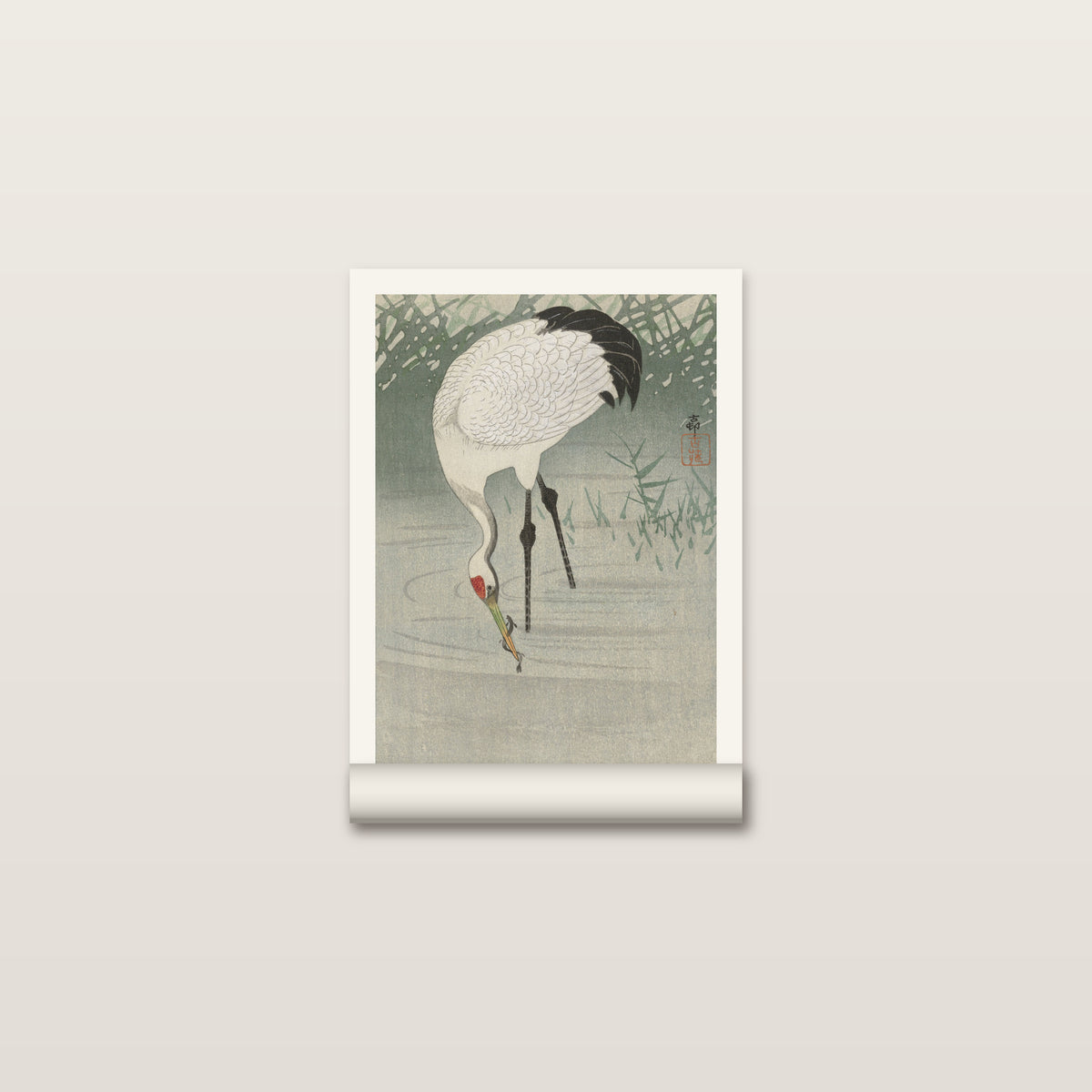 Toile roulée de la grue d'Ohara Koson posée à plat, les roseaux en haut et sa marge blanche autour